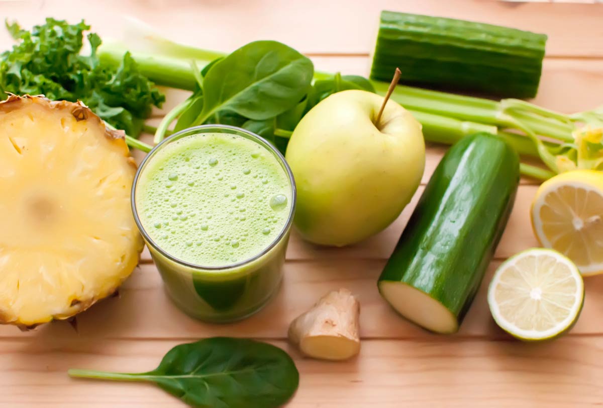 Green smoothie with pineapple, apple, cucumber and spinach