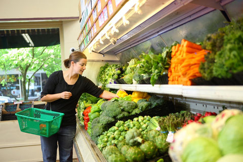 Woman shopping for fresh vegetables
