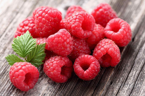 Fresh raspberries on a wooden table