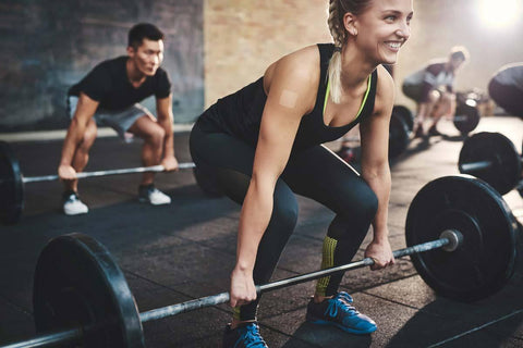 Woman lifting weights in a gym