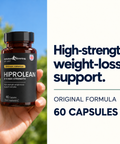 Hand holding a HiProLean bottle outdoors, original formula, 60 capsules